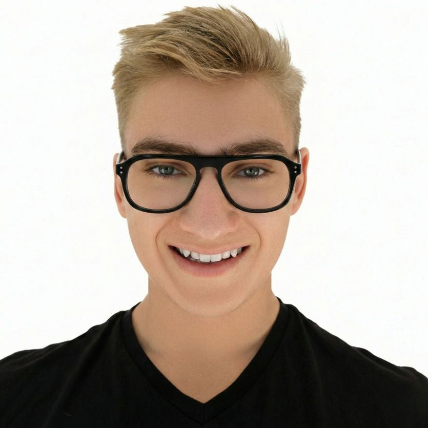 Person wearing black glasses and a black shirt on a white background